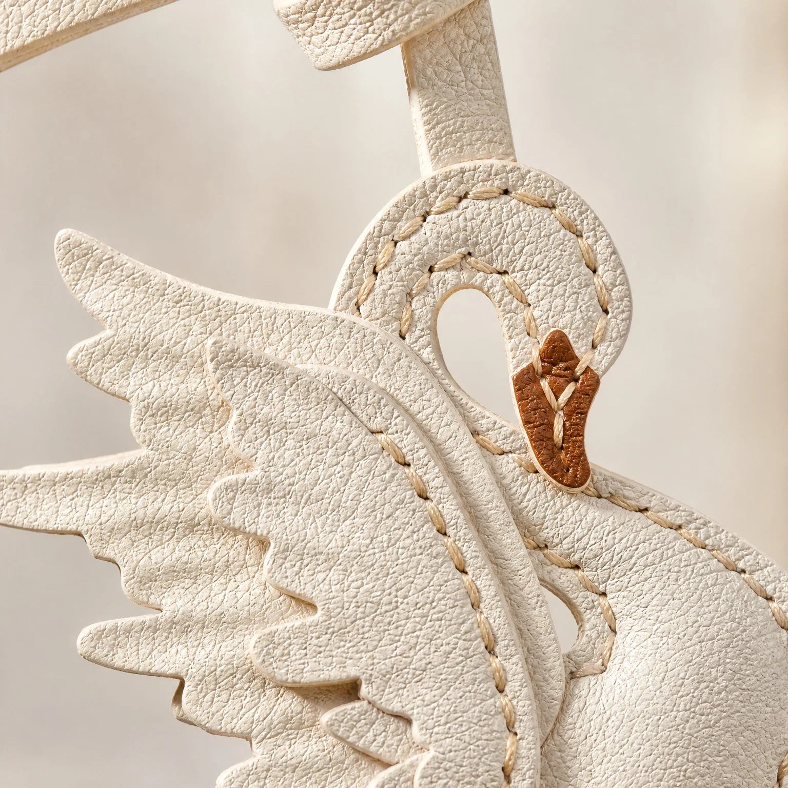 The Swan Charm in Alran Goatskin